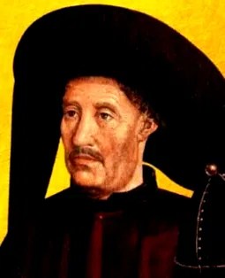 Portrait of a man in a large black hat against a yellow background.